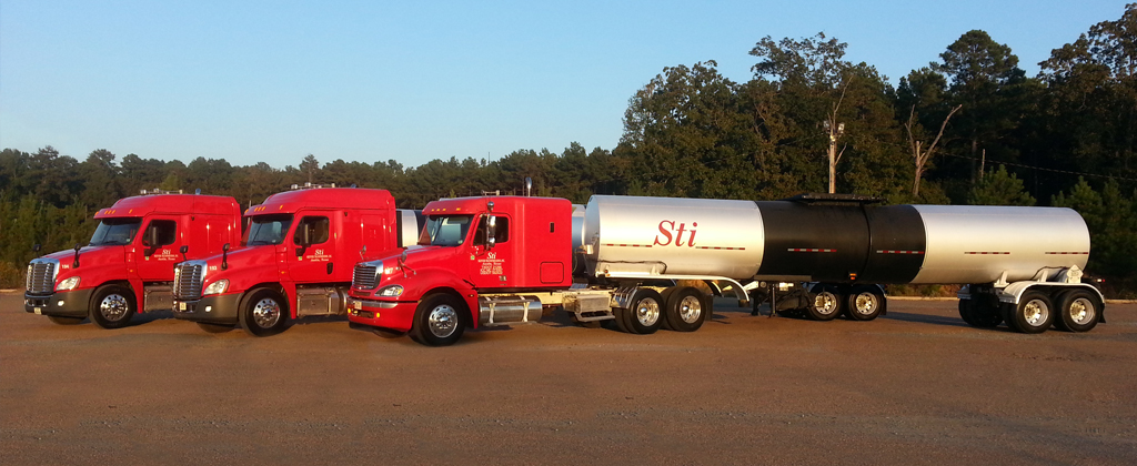 Skinner Transportation red tractors lined up at the terminal