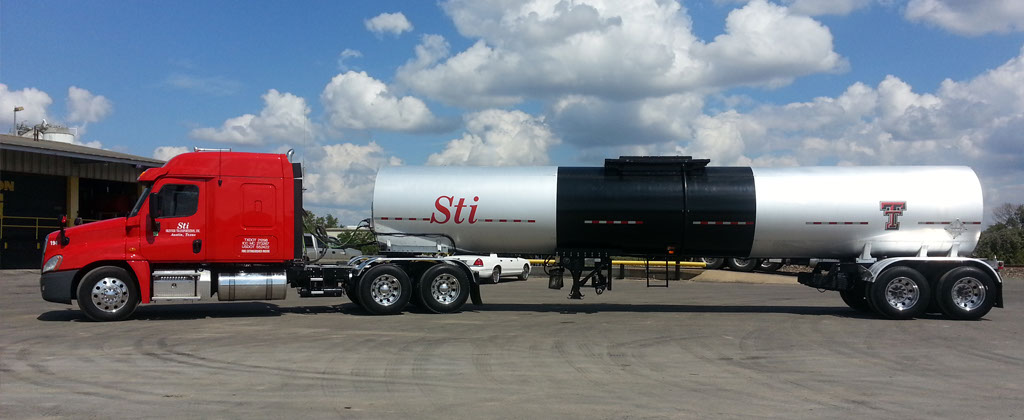 Skinner Transportation truck hauling materials on a paving job